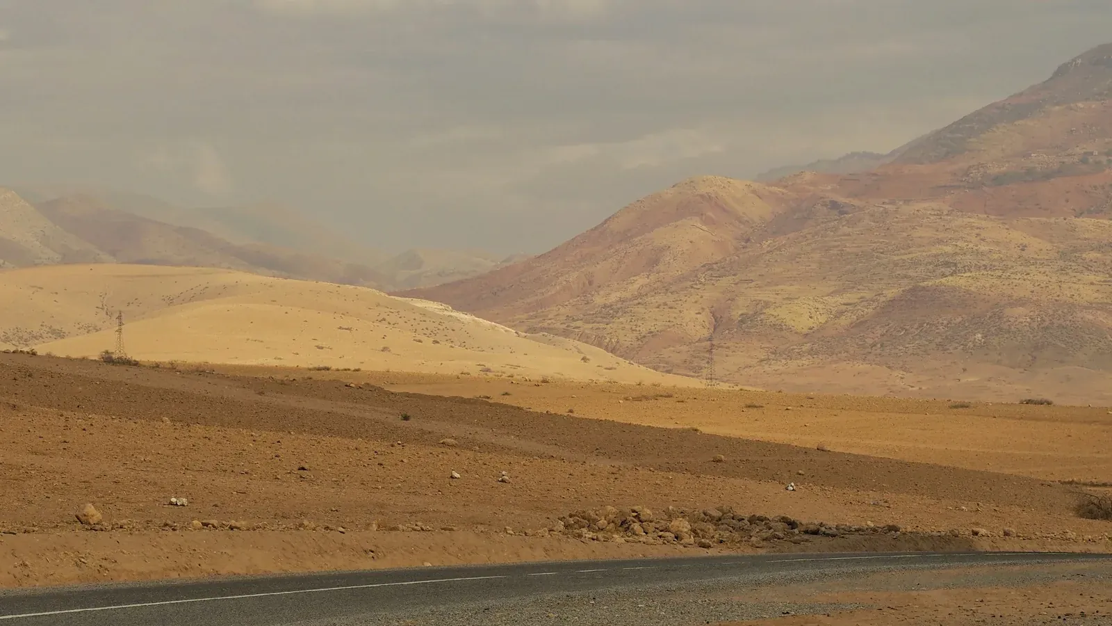 A road through the rocky Agafay landscape outside Marrakech